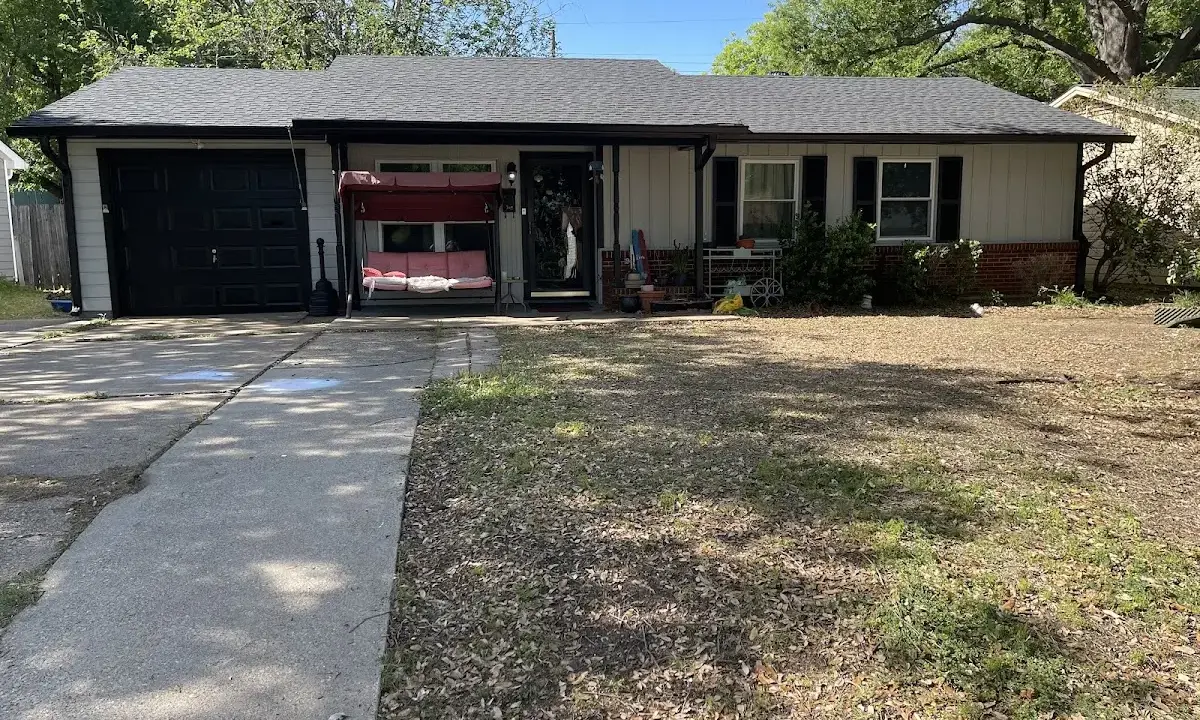Wind Damage Roof Repair crew at work on a residential roof in Jacksonville